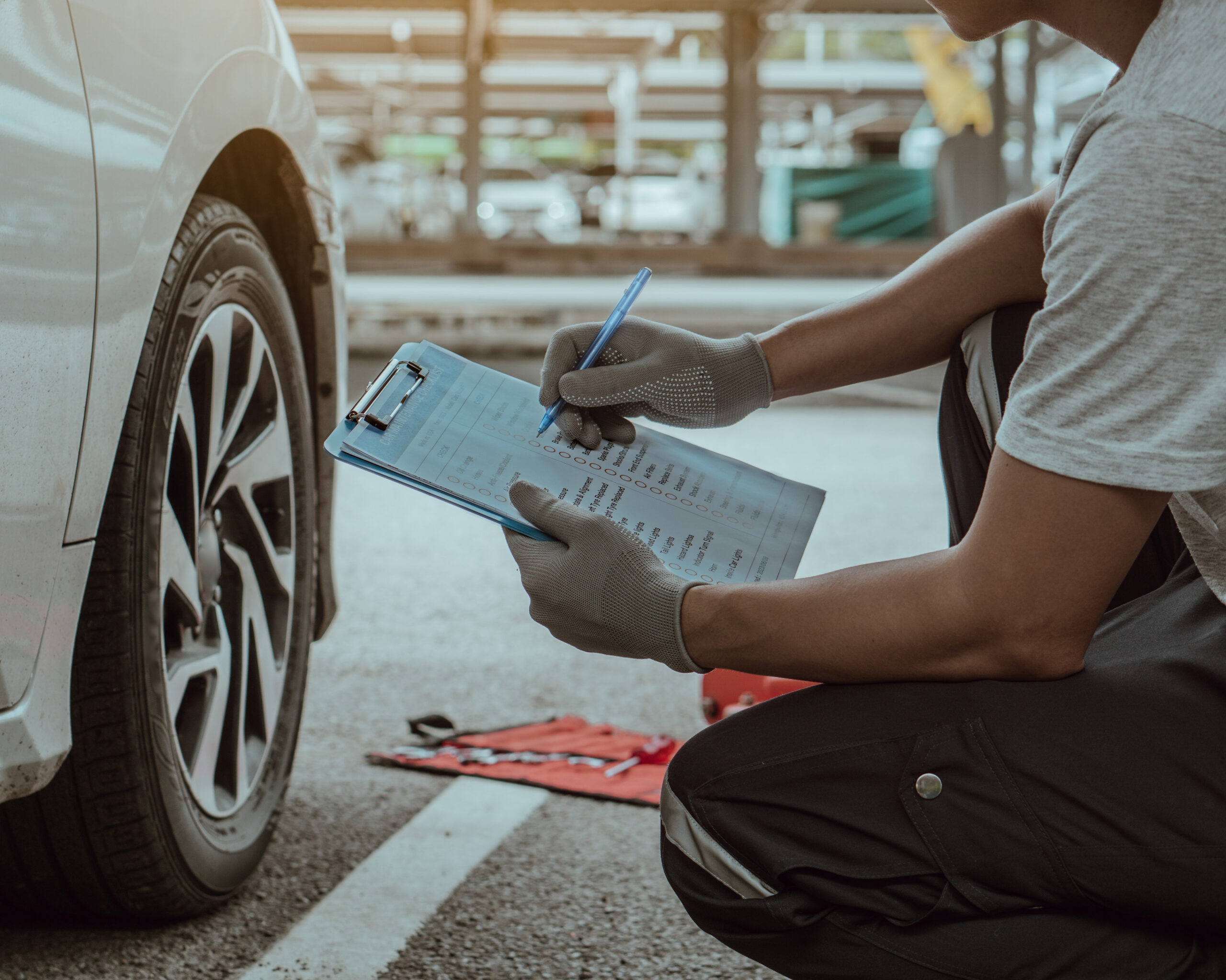mechanic-holding-the-clipboard-to-checking-car-whe-2026-03-13-01-54-16-utc